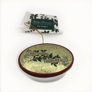 Vintage Holiday Decoration Hallmark Tree Trimmer Oval 3” Gold Holly Tin Ornament